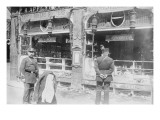 Parisian Police Look at German Shops Ransacked By Mob