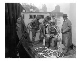 Inspecting the Piles at Tacoma  Diver on Deck in Suit  1924