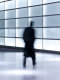 Germany  Berlin  Glass Walled Passageway in Modern Building - People Commuting