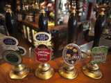 England  London  Beer Pump Handles at the Bar Inside Tradional Pub