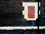 Derelict Bricked in Window with Drainpipe