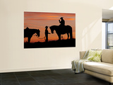 Cowboy and Cowgirl Silhouetted on a Ridge in the Big Horn Mountains  Wyoming  USA