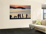 People on Patong Beach Silhouetted at Sunset