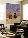 Cowboy and Cowgirl Riding Through Scenic Hills of the Big Horn Mountains  Shell  Wyoming  USA