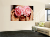 Young Girl Holding Camellia Flowers over Her Eyes