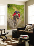 Mountain Biker Splashes Through Andrews Creek  Maah Daah Hey Trail in Medora  North Dakota  USA