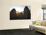 Female Tourist Photographer at Bayon Temple at Sunset