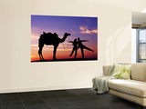 Tourists with Camel Silhouetted at Sunset at Sam Sand Dunes in Great Thar Desert