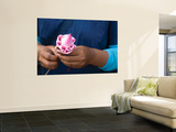 Woman in Blue Dress Holding Pink Lotus Flower