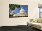 Nipponzan Myohoji Stupa  on Top of Ratnagiri Hill  with Four Golden Statues of Buddha