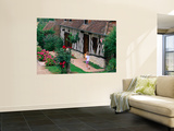 Child with Baguettes in Front of Half-Timbered Cottage