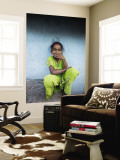 Litle Girl Self-Consciously Covering Her Mouth as She Smiles
