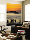 People on Patong Beach Silhouetted at Sunset