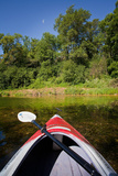 Kayak on a Forested Lake