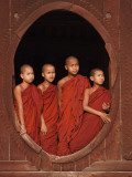 Myanmar  Burma  Nyaungshwe; Young Novice Monks Standing at a Wooden Oval Window