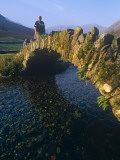 Eskdale  Cumbria  Walkers Crossiing a Tradition Stone Bridge