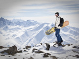 A Snowboarder at the Summit of Mount Affawat in Gulmarg  Kashmir  India