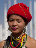 Myanmar  Burma  Loikaw; a Kayah Girl in Front of Ceremonial Posts at Chitkel Village