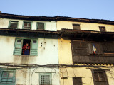 Nepal  Kathmandu  a Woman Looks Out of a Window at Swayambunath Temple (Monkey Temple)