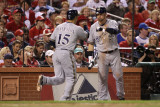 Brewers v St Louis Cardinals - Oct 12: Jerry Hairston Jr and Mark Kotsay