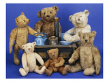 A Selection of Teddy Bears around a Black Painted Tinplate Toy Stove