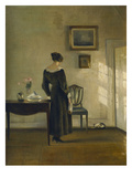 An Interior with a Woman Feeding a Cat