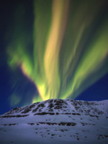 Aurora Borealis over Toviktinden Mountain in Troms County  Norway