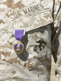 The Purple Heart Award Hangs over the Heart of a US Marine