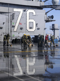 Sailors Scrub the Flight Deck Aboard the Aircraft Carrier USS Ronald Reagan