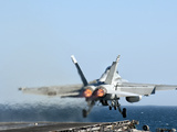 An F/A-18F Super Hornet Launches from the Flight Deck of Aircraft Carrier USS Nimitz