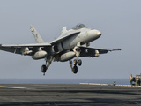 A US Navy F/A-18C Hornet Prepares to Land Aboard USS Eisenhower