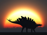 A Stegosaurus Silhouetted Against the Setting Sun at the End of a Prehistoric Day
