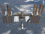 International Space Station Backgropped by a Blue and White Earth