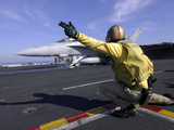 A Shooter Signals the Launch of an F/A-18 Super Hornet