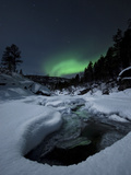 Aurora Borealis over Tennevik River in Norway