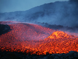 Boulder Rolling in Lava Flow at Dusk During Eruption of Mount Etna Volcano  Sicily  Italy