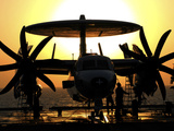 Sailors Work on an E-2C Hawkeye Aircraft Aboard USS Abraham Lincoln