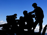 Silhouette of Soldiers Operating a BGM-71 Tow Guided Missile System