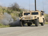 A Mock Improvised Explosive Device Explodes in the Window of a Humvee