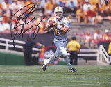 Peyton Manning Autographed Tennessee White Jersey Dropping Back Horizontal Photograph