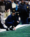 Lou Holtz And Ken Regan Dual Autographed Holtz Inscribed '1990' Crouching On Sideline Photograph