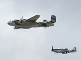 A B-25 Mitchell and a P-51 Mustang in Flight