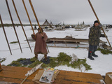 Komi Tribespeople Erect the Poles of their Reindeer-Skin Chum
