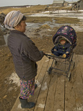 A Nenet Woman and Her Baby Wait Outside a Store in Snopa Village