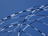 Detail of Three Kite Tails Crossing One Another