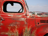 A Close-Up of an Abandoned Red Truck