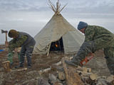 A Nomadic Komi Reindeer Herders Chops and Saw Wood to Heat their Chum