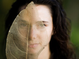 A Model Holds Up a Transparent Leaf