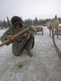 A Nomadic Komi Reindeer Herder Fishes in a Hole with Primitive Gear