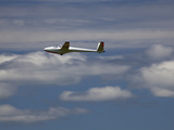 A Glider Plane Floats Among the Clouds